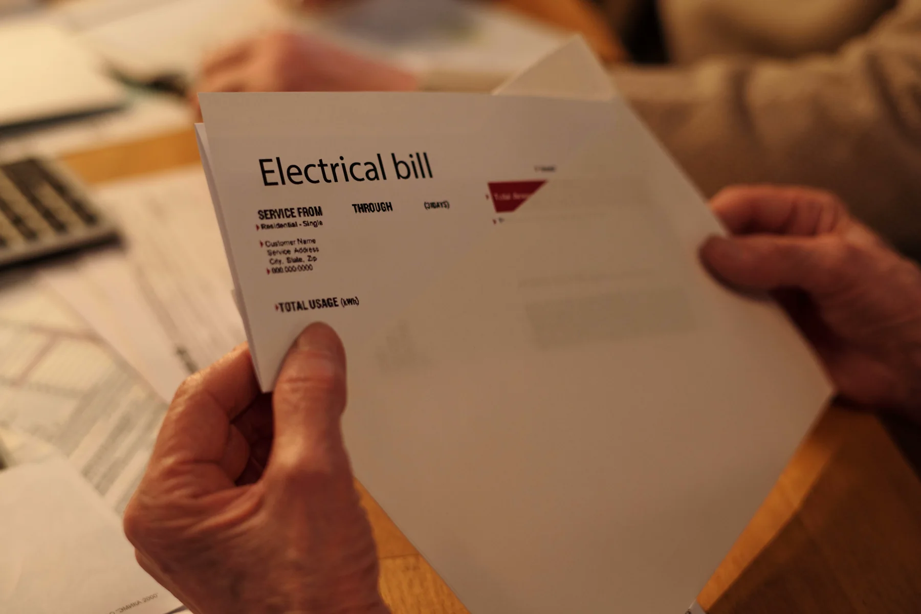 Person reviewing an electrical bill
